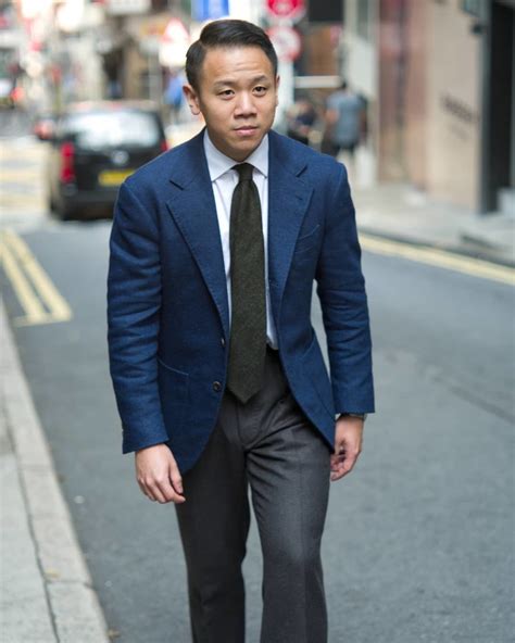 blue blazer with charcoal pants.